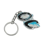 2336-2-Portachiavi irregolare nichelato con punto blu dipinto